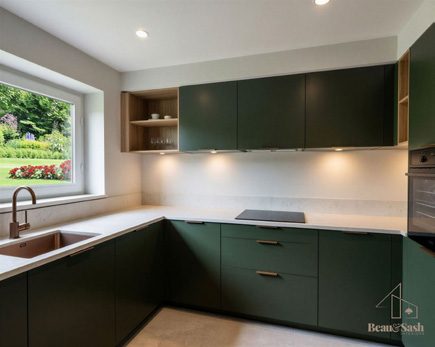 Kitchen with green units and quartz worktops